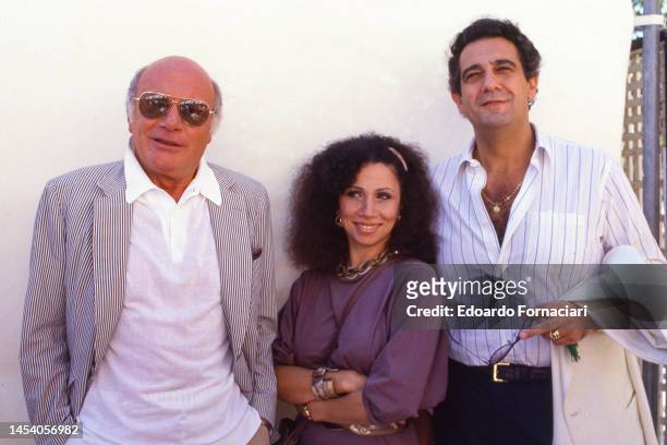 View of, from left, film director Francesco Rosi and opera singers Julia Mvigenes-Johnson and Placido Domingo as they promote their film 'Carmen' at...