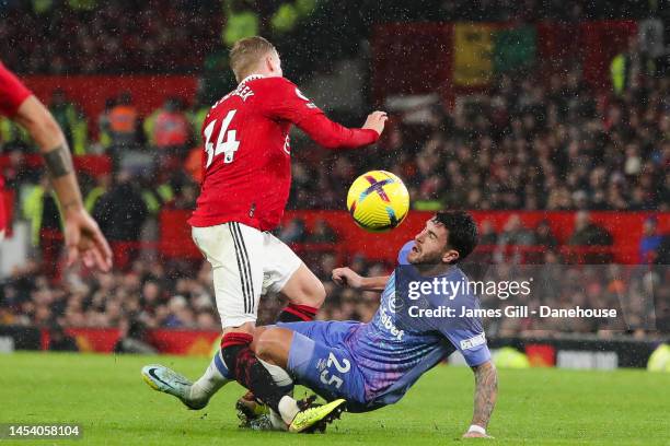 Donny van de Beek of Manchester United is fouled by Marcos Senesi of Bournemouth leading to an injury during the Premier League match between...