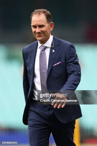 Former Australian coach and commentator Justin Langer walks across the field during day one of the Third Test match in the series between Australia...