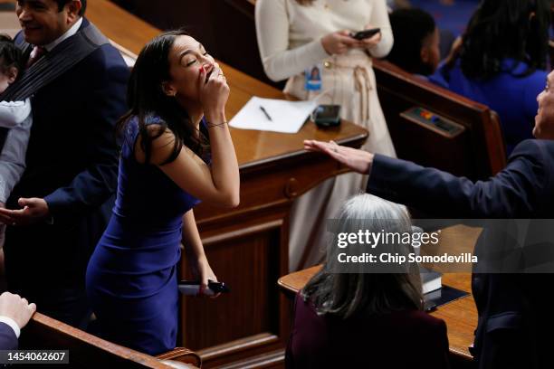 Rep. Alexandria Ocasio-Cortez shares a laugh in the House Chamber after the new Congress failed to elect a new Speaker of the House at the U.S....