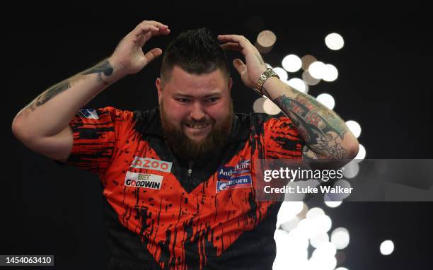 Michael Smith of England celebrates the win during the Finals against Michael van Gerwen of Netherlands during Day Fourteen of the Cazoo World Darts...