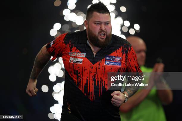 Michael Smith of England celebrates the win during the Finals against Michael van Gerwen of Netherlands during Day Fourteen of the Cazoo World Darts...