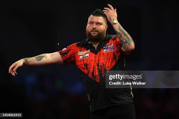 Michael Smith of England celebrates the win during the Finals against Michael van Gerwen of Netherlands during Day Fourteen of the Cazoo World Darts...