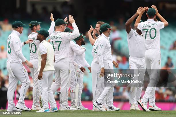 Anrich Nortje of South Africa celebrates with team mates the wicket of David Warner of Australia during day one of the Third Test match in the series...