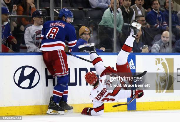 Jacob Trouba of the New York Rangers checks Andrei Svechnikov of the Carolina Hurricanes during the third period at Madison Square Garden on January...