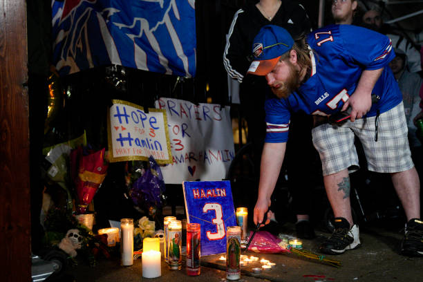 Buffalo Bills fan Dustin Peters attends a candlelight vigil for Buffalo Bills safety Damar Hamlin at University of Cincinnati Medical Center on...