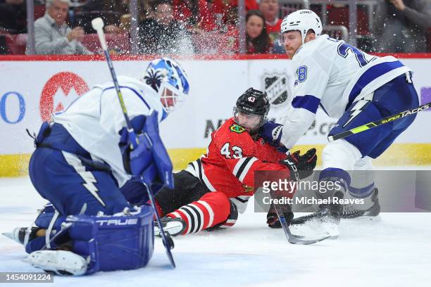Brian Elliott of the Tampa Bay Lightning makes a save on a shot by Colin Blackwell of the Chicago Blackhawks during the second period at United...