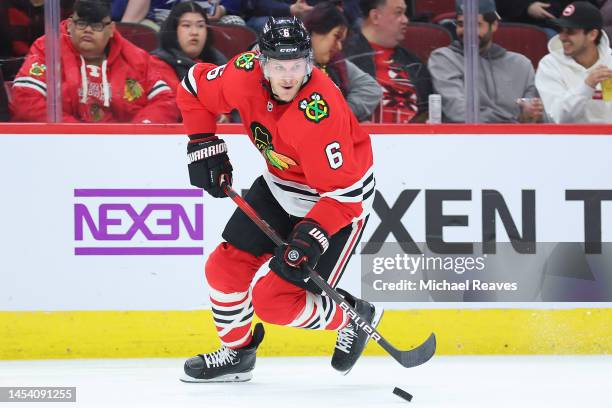 Jake McCabe of the Chicago Blackhawks skates with the puck against the Tampa Bay Lightning during the second period at United Center on January 03,...