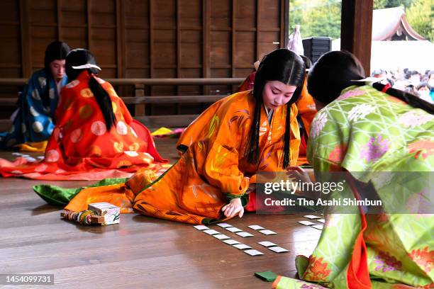 Women dressed in traditional attire from the Heian Period take part in the first 'karuta' game of the New Year at Yasaka Jinja Shrine on January 03,...