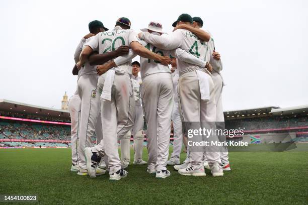 Players of South Africa huddle during day one of the Third Test match in the series between Australia and South Africa at Sydney Cricket Ground on...