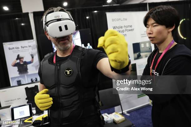 Man tries out the Haptic Suit by bHaptics during a press event at CES 2023 at the Mandalay Bay Convention Center on January 03, 2023 in Las Vegas,...