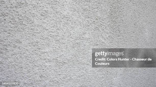 white painted and textured roughcast wall in paris - roughcast stock pictures, royalty-free photos & images