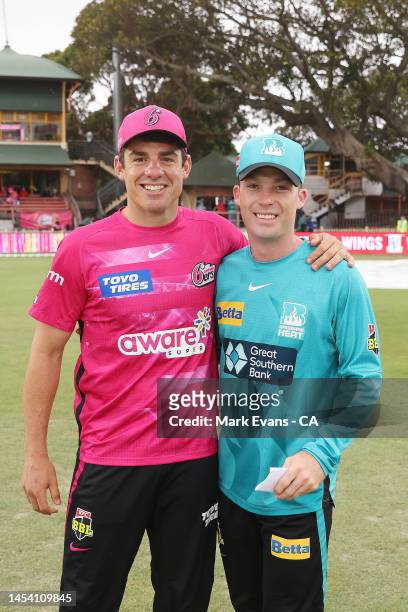 Moises Henriques of the Sixers poses with Jimmy Peirson of the Heat ahead of the Men's Big Bash League match between the Sydney Sixers and the...
