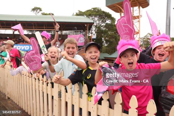 Young Sixers fans cheer during the Men's Big Bash League match between the Sydney Sixers and the Brisbane Heat at North Sydney Oval, on January 04 in...