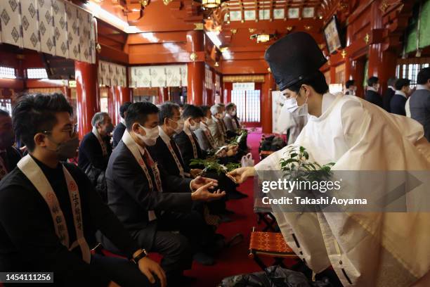 Shinto priest offers blessings during a ceremony at Kanda Myojin Shrine on January 04, 2023 in Tokyo, Japan. Kanda Myojin Shrine is located near...