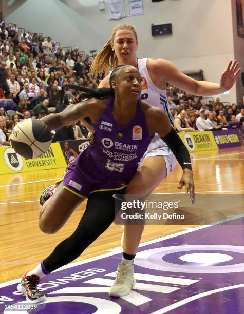 Tiffany Mitchell of the Boomers drives past Sara Blicavs of the Flyers during the round nine WNBL match between Melbourne Boomers and Southside...