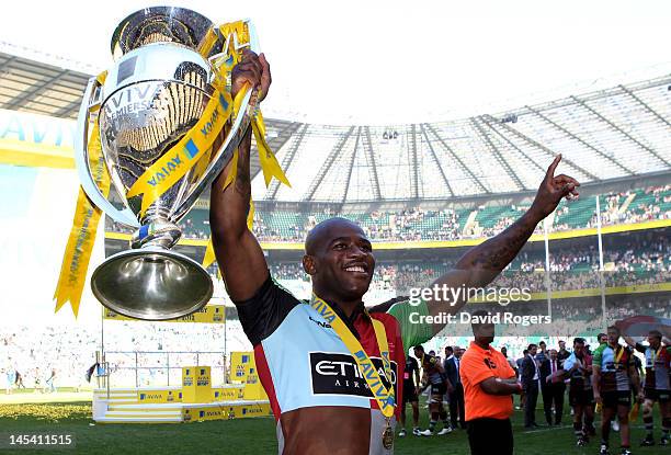 Ugo Monye of Harlequins celebrates with the trophy following his team's victory during the Aviva Premiership final between Harlequins and Leicester...