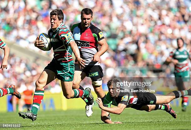 Anthony Allen of Leicester breaks the tackle from Nick Evans of Harlequins to score a try during the Aviva Premiership final between Harlequins and...