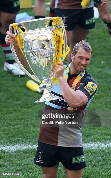 Harlequins captain Chris Robshaw lifts the trophy following his team's victory during the Aviva Premiership final between Harlequins and Leicester...