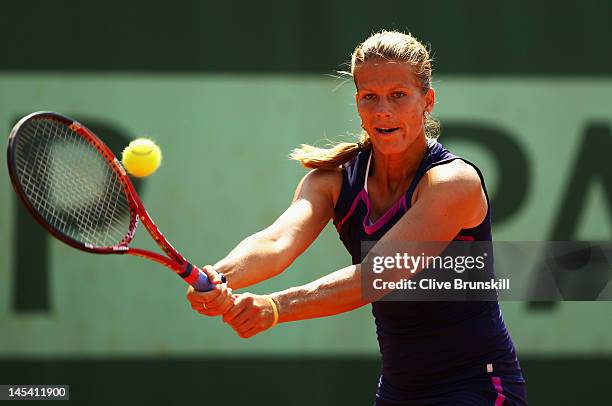 Melinda Czink of Hungary plays a backhand in her women's singles first round match between Anne Keothavong of Great Britain and Melinda Czink of...