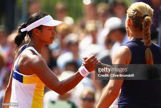 Anne Keothavong of Great Britain looks dejected as she shakes hands with Melinda Czink of Hungary after their women's singles first round match...