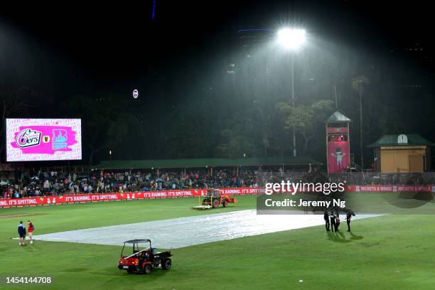 General view of the inclement weather at the innings break during the Men's Big Bash League match between the Sydney Sixers and the Brisbane Heat at...