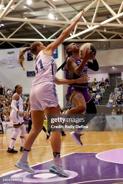 Tiffany Mitchell of the Boomers drives to the basket against Carley Ernst of the Flyers during the round nine WNBL match between Melbourne Boomers...