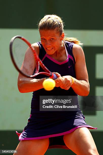 Melinda Czink of Hungary plays a backhand in her women's singles first round match between Anne Keothavong of Great Britain and Melinda Czink of...