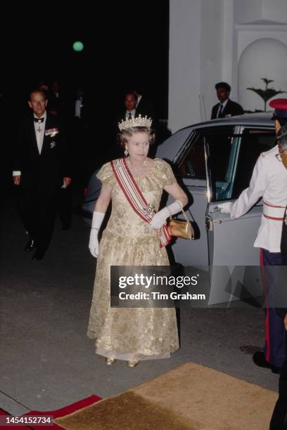 Queen Elizabeth II, wearing the Girls of Great Britain and Ireland diamond tiara, attend a State Banquet during the Queen's visit to Singapore, 10th...