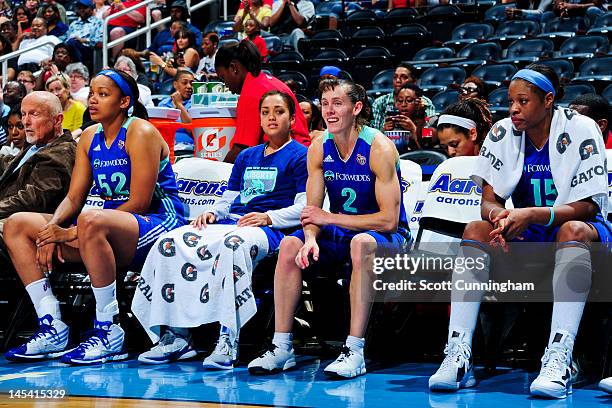 New York Liberty players, from left, Kelley Cain, Leilani Mitchell, Kelly Miller and Kia Vaughn sit on the bench while playing against the Atlanta...