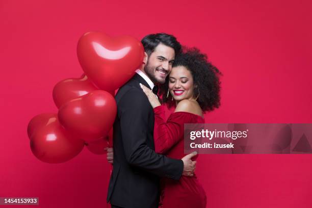 beautiful couple celebrating valentine's day - black woman red dress stock pictures, royalty-free photos & images