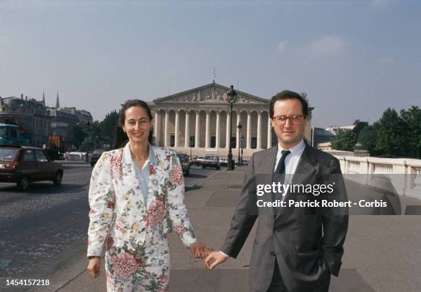 French socialist politicians Segolene Royal and husband Francois Hollande stand outside the National Assembly in Paris.