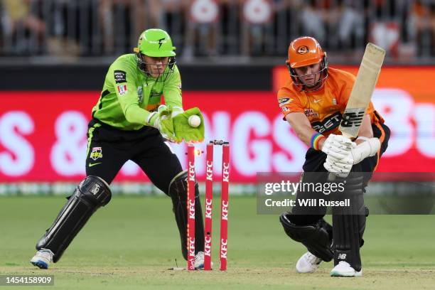 Jhye Richardson of the Scorchers is bowled by Usman Qadir of the Thunder during the Men's Big Bash League match between the Perth Scorchers and the...