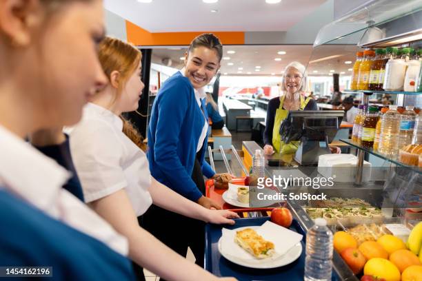 waiting to pay - canteen stock pictures, royalty-free photos & images