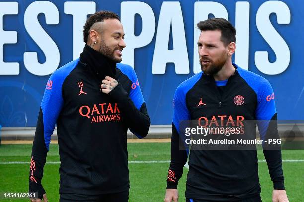 Leo Messi speaks with teammate Neymar Jr before a Paris Saint-Germain training session at PSG training center on January 04, 2023 in Paris, France.