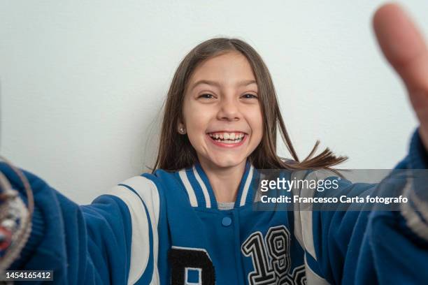 smiling girl taking a selfie - girls bildbanksfoton och bilder