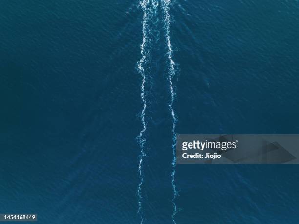 aerial view of a ship sailing on the sea - 航跡 ストックフォトと画像