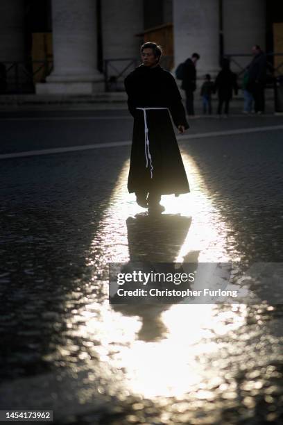 Monk walks through Saint Peter's square ahead of the funeral of Pope Emeritus Benedict XVI at St. Peter's Basilica on January 04, 2023 in Vatican...