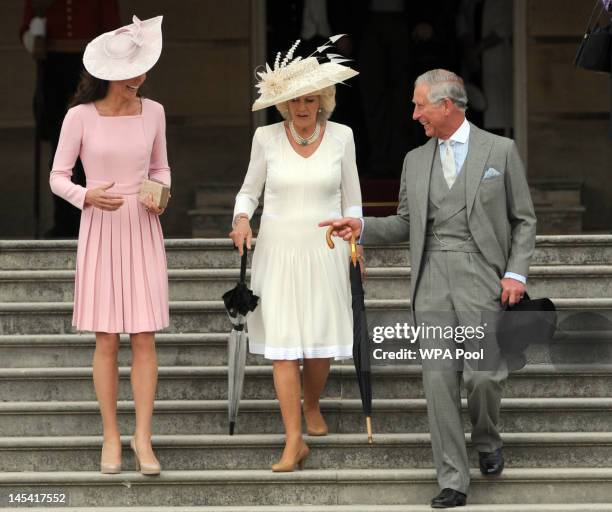 Catherine, Duchess of Cambridge, Camilla, Duchess of Cornwall and Prince Charles, Prince of Wales attend a garden party at Buckingham Palace on May...