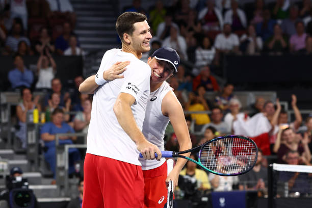 Iga Swiatek and Hubert Hurkacz of Poland celebrate winning against Camilla Rosatello and Lorenzo Musetti of Italy in their mixed doubles match during...