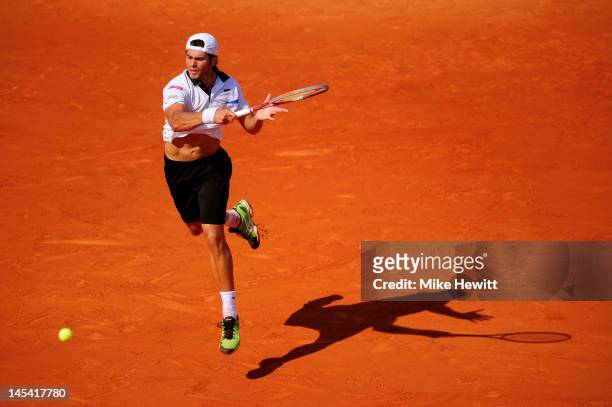 Simone Bolelli of Italy plays a forehand in his men's singles first round match against Rafael Nadal of Spain during day 3 of the French Open at...