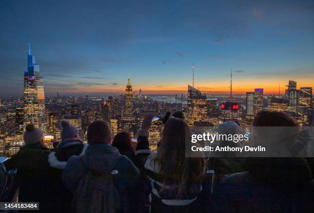 Visitors to the Rockefeller Center observation deck view the Manhattan skyline including One Vanderbilt, the second tallest office building in New...