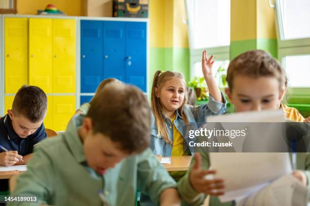 children learning in the elementary school. - democracy uk stock pictures, royalty-free photos & images