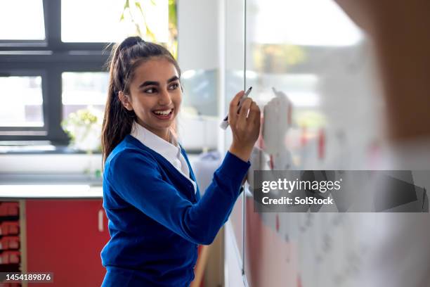 writing on a white board at school - 16 year old female stock pictures, royalty-free photos & images