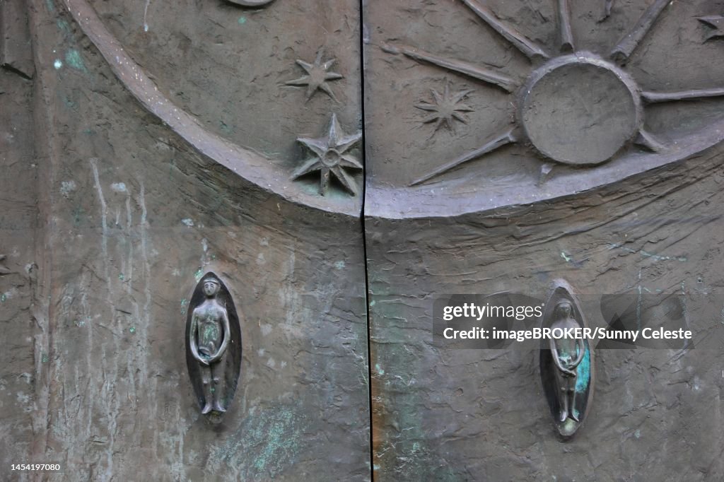 Entrance door with Adam and Eve, St. Boniface, a former free-world ladies' convent with a collegiate church in Freckenhorst, Warendorf district, North Rhine-Westphalia, Germany