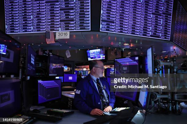 Traders work on the floor of the New York Stock Exchange during morning trading on January 04, 2023 in New York City. U.S. Stocks rose at the start...