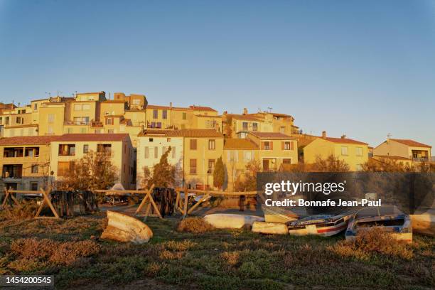 the village of bages, its boat in a morning light. - aude stock pictures, royalty-free photos & images