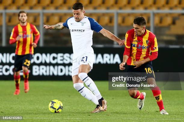 Sergej Milinković-Savić of SS Lazio and Joan González of US Lecce in action during the Serie A match between US Lecce and SS Lazio at Stadio Via del...