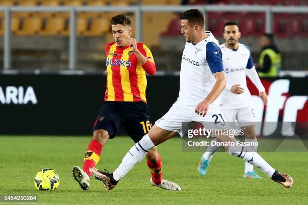 Sergej Milinković-Savić of SS Lazio and Joan González of US Lecce in action during the Serie A match between US Lecce and SS Lazio at Stadio Via del...