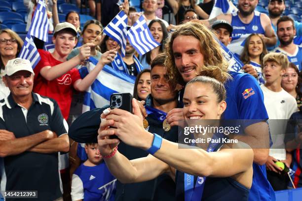 Maria Sakkari of Greece takes a photo with Stefanos Tsitsipas and Petros Tsitsipas after becoming the Perth City Winners during day seven of the 2023...